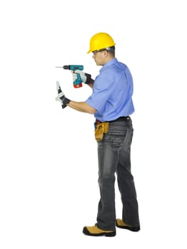 Construction worker in protective workwear holding electric drill machine over white background