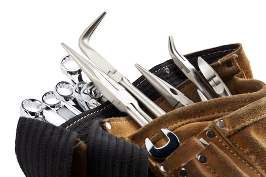 A close-up cropped image of workers belt with construction tools isolated on white 