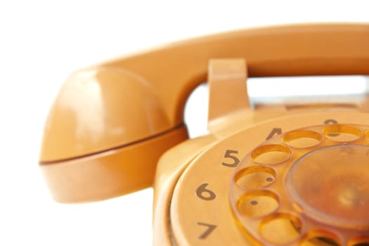 close up image of orange vintage phone