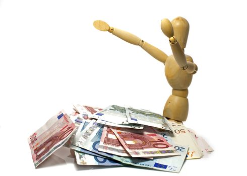wooden puppet in euro money