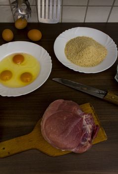 preparations for cooking schnitzel in the kitchen