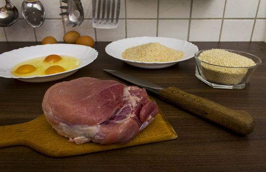 preparations for cooking schnitzel in the kitchen