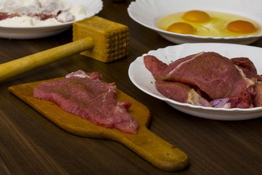 preparations for cooking schnitzel in the kitchen