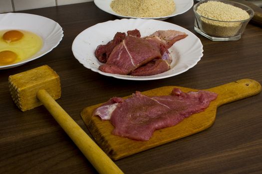 preparations for cooking schnitzel in the kitchen