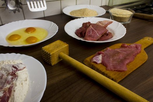 preparations for cooking schnitzel in the kitchen