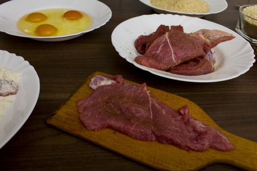 preparations for cooking schnitzel in the kitchen