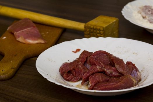 preparations for cooking schnitzel in the kitchen