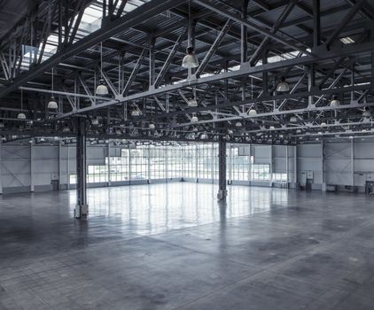 Interior of an empty warehouse with glass wall