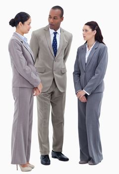 Two business people watching their copworker against white background