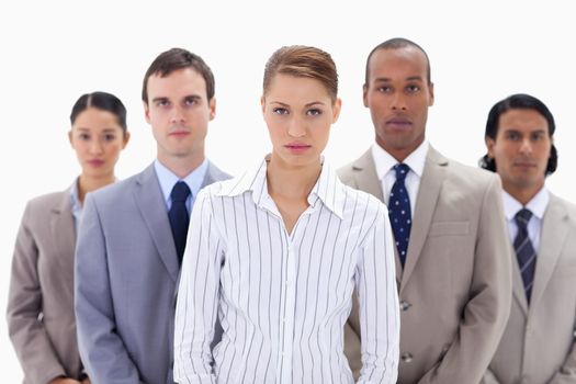 Close-up of a serious business team with focus on the woman in the center