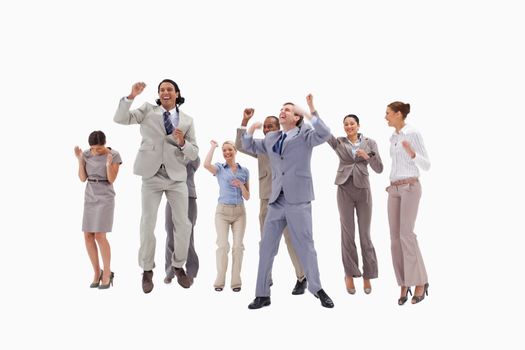 Very happy business people jumping against white background