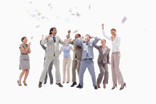 Very enthusiast people jumping and raising their arms with money falling from the sky against white background
