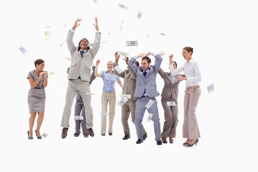 Very happy people with money falling from the sky against white background
