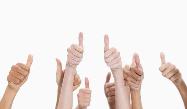 Thumbs-up against white background