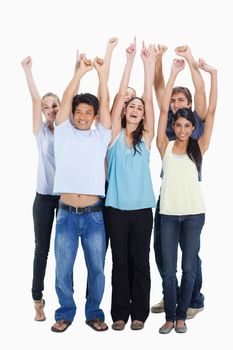 People smiling together and raising their arms against white background