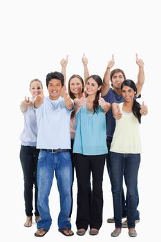 People smiling together and approving with the thumbs-up against white background
