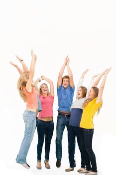A group of friends cheering as they jump in the air and look at one another while smiling