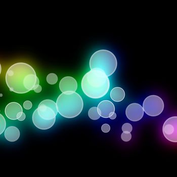 Multicolored blurred circles melding together against a black background