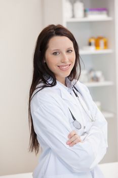 Woman doctor with crossed arms in a doctor's office