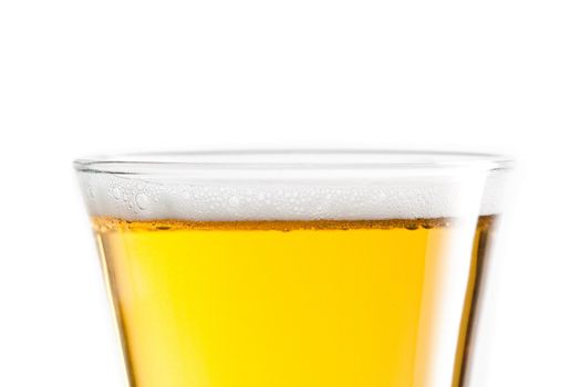 Top of a full glass of beer against a white background