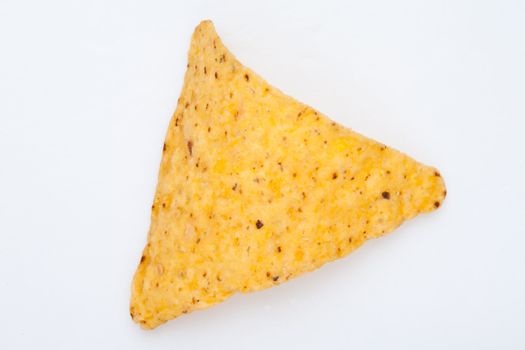 Close up of a triangle nacho against a white background