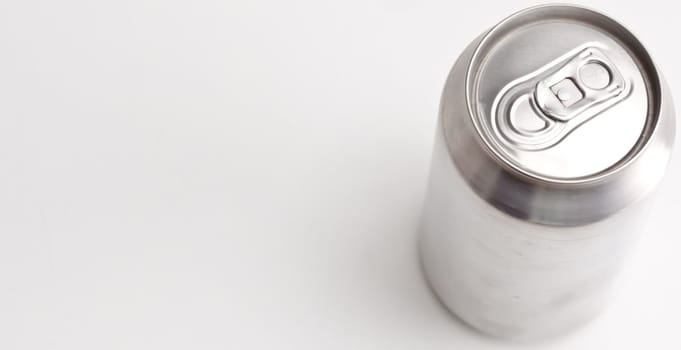 High angle horizontal view of a closed aluminium can against a white background