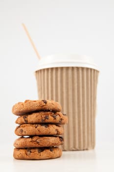 Cookies and a cup of tea placed together against a white background