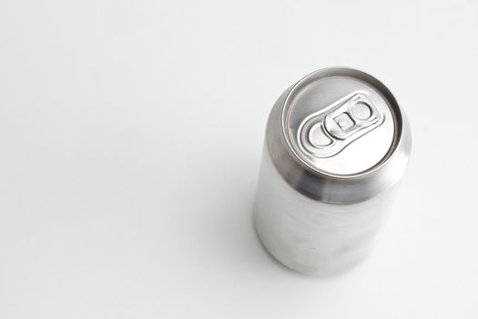 High angle view of a closed aluminium can against a white back ground