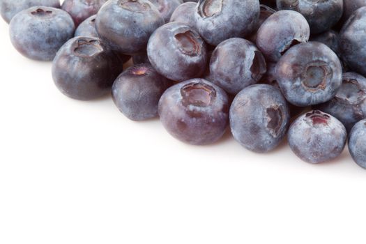 Abundance of blueberries against a white background