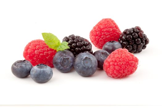 Choice of berries against a white background