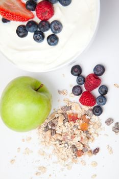 Healthy eating with fruits and cereals  against a white background
