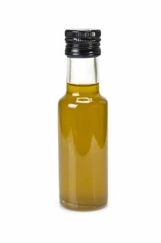 Glass bottle of premium virgin olive oil and some olives with leaves isolated on a white background