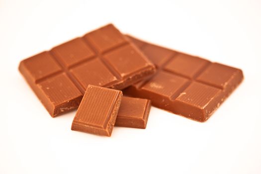 Two bars of chocolate against a white background