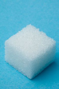 Sugar against a blue background