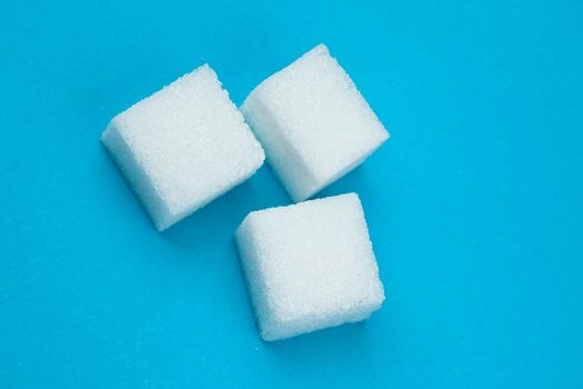 Sugars against a blue background