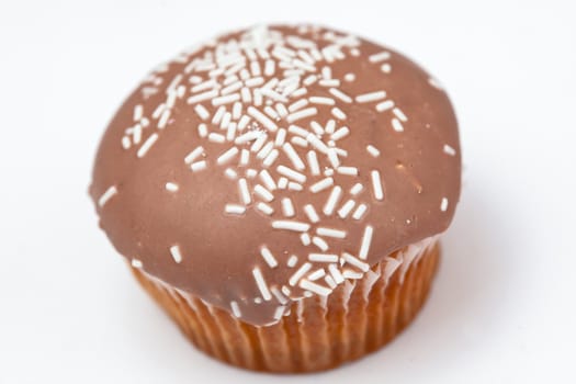 Brown cupcake against a white background