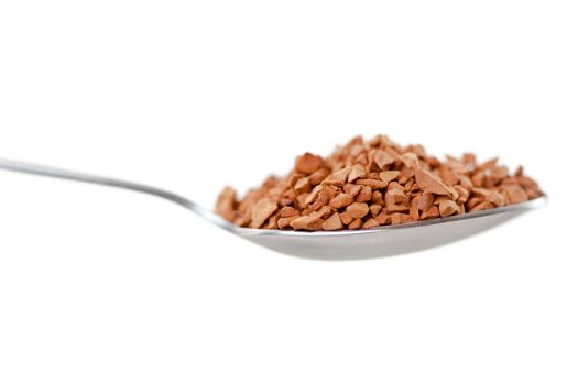 Spoon with chocolate powder against white background