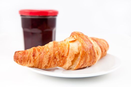 Breakfast with croissant  against a white background