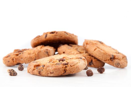 Tasty cookies with chocolate chops against white background