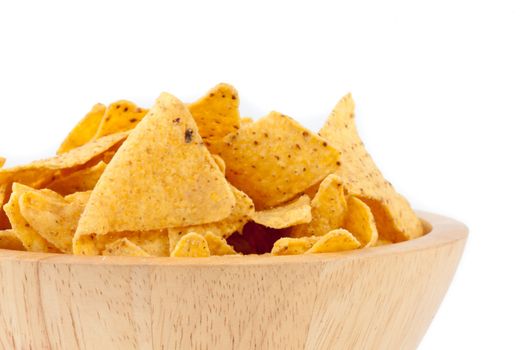 Bowl full of crisps against white background