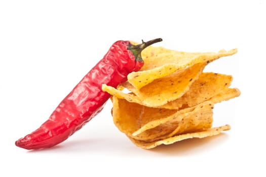 Pepper beside a small stack of crisps against white background