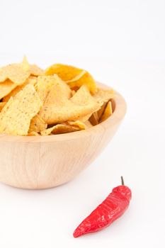 Pimento near a full bowl of crisps  against white background