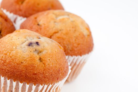 Small baked muffins against a white background