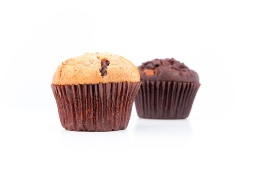 Two fresh baked muffins against a white background