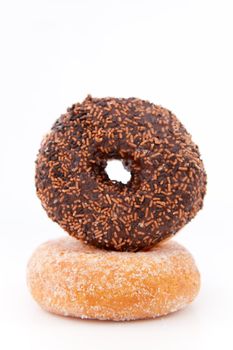 Doughnuts with icing sugar against a white background