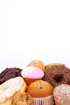 Cakes piled together against a white background