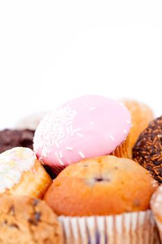 Close up of cakes with icing sugar against a white background