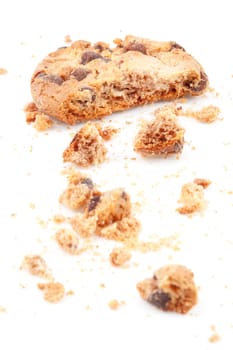 Close up of an half eaten cookie against a white background