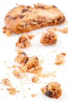 half eaten blurred cookie against a white background