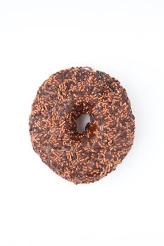 Close up of a chocolate doughnut against a white background